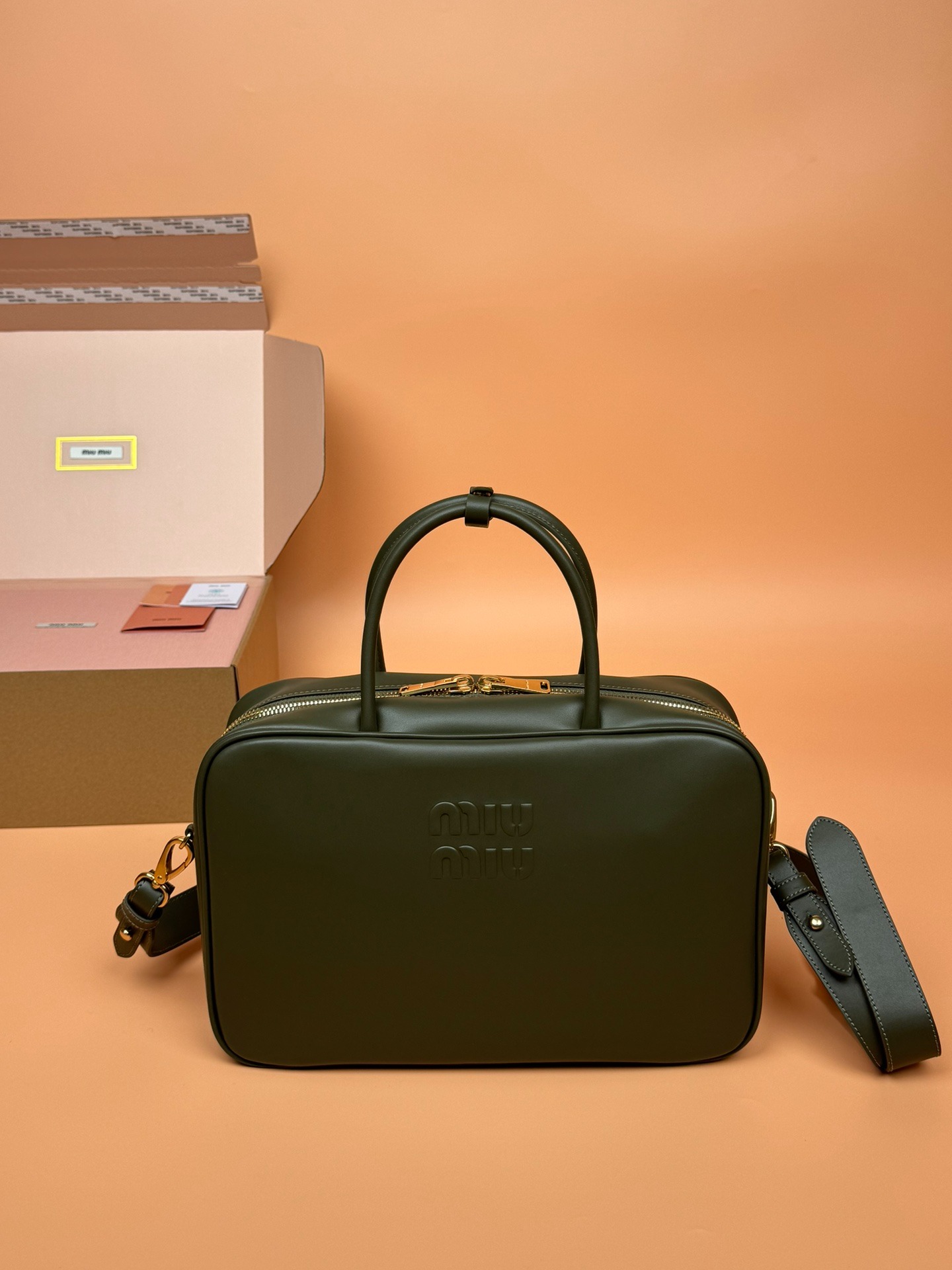 미우미우 탑 핸들 가죽 보 백