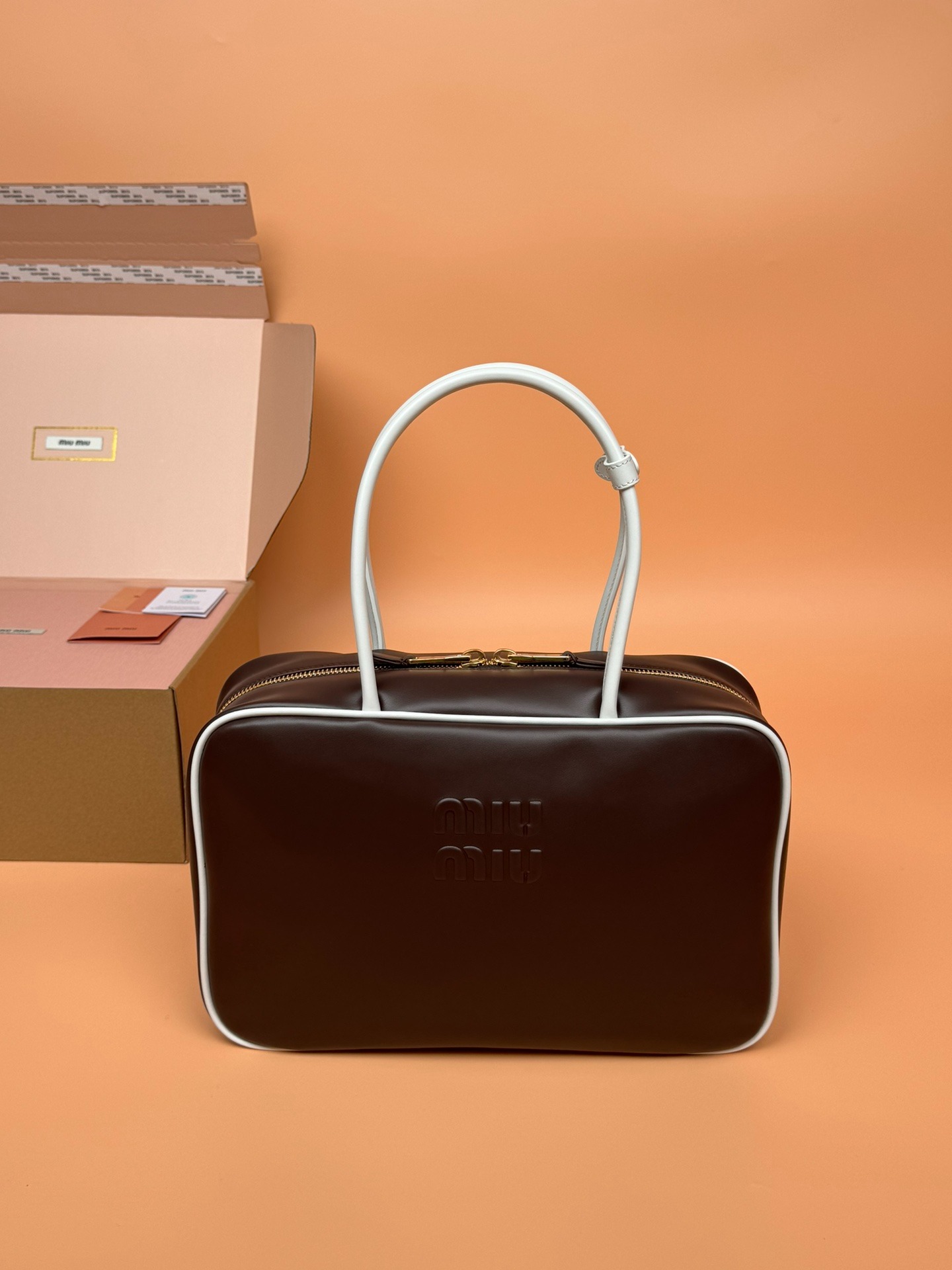 미우미우 탑 핸들 가죽 보 백